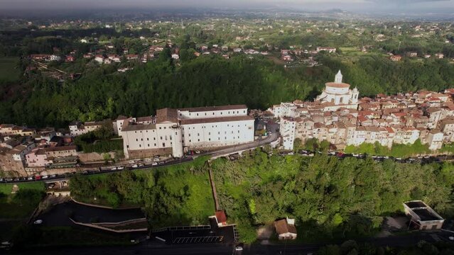 Elevated town Zagarolo on a tuff hill in Italy, aerial sideways, panorama view