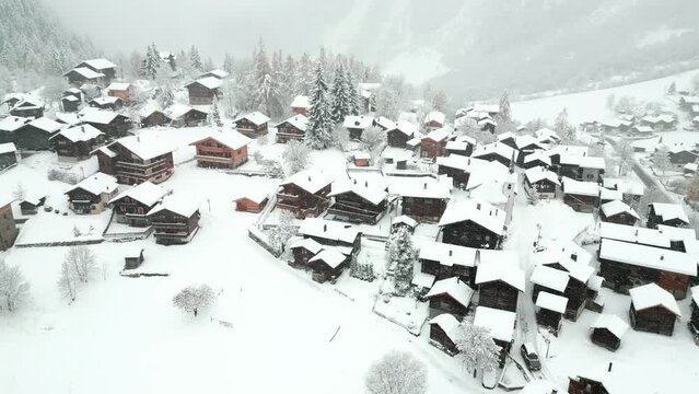 A small village with old huts in a snowstorm. It is Blatten near Naters in the canton of Valais in Switzerland