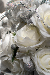 Closeup view of a bouquet of white artificial roses	