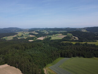 Bavarian forest with fields and meadows