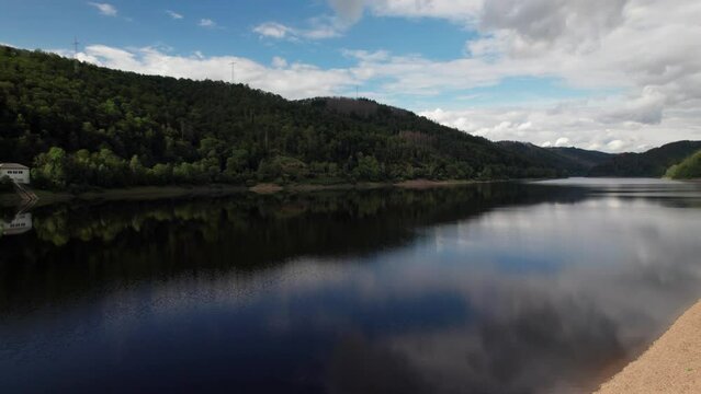 Aerial drone video of flight over the lake in Bad Lauterberg Germany.