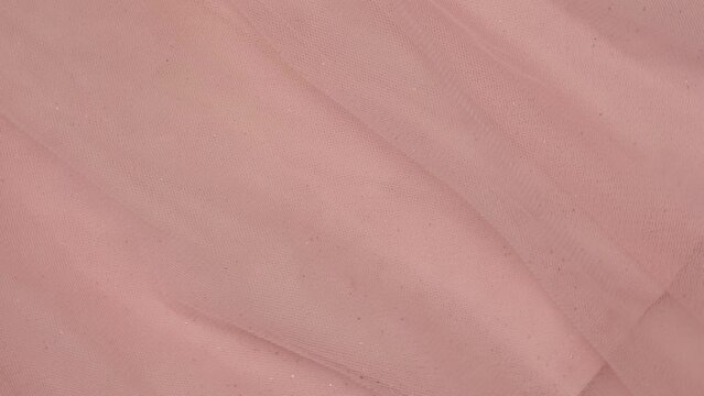 Soft Chiffon Detailed Texture. Natural Mesh Fabric Closeup Knit Pattern. Pink Light Polyester Surface. Rotation, Macro. Cozy Textile Background. Clothes Production. Melange Yarn. 4K Shot