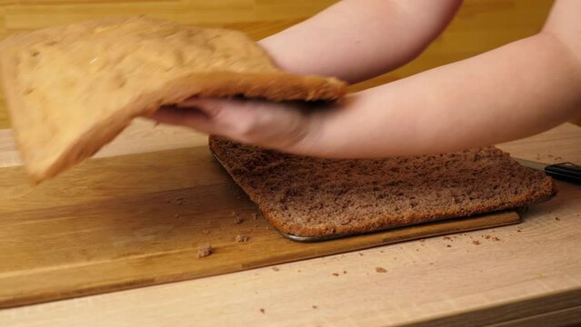 The baked cake is cut lengthwise for the filling