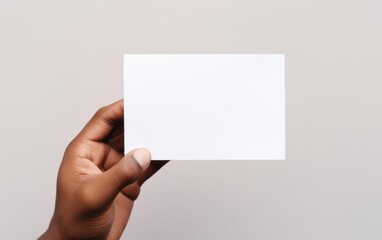 Fototapeta premium mockup of card for note in person's hand