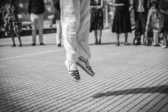 Basque dancer jumping in a celebration in a town in the Basque country, black and white photo