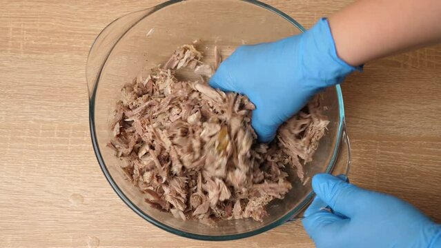 Salt and spices are added to the meat. Preparation of meat dishes.