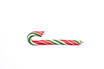 Striped new year candy cane on white background