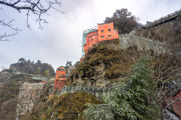 Ancient buildings in China's Wudang Mountains are elegantly decorated with a layer of snow,...