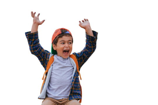 Angry little boy yelling raising hands up looks away against blurry forest at beach. People emotions concept. Childhood.