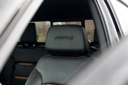Close-up of an open door and seat of a GMC AT4 off-road truck