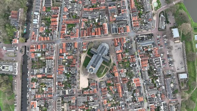 Top down drone shot over Grote Kerk Naarden and surrounding buildings in Naarden city, Netherlands