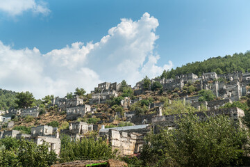 Fototapeta na wymiar Kayaköy Abandoned ghost town, stone houses and ruins. The site of the 18th century Ancient Greek city of Karmilissos. Fethiye – TURKEY