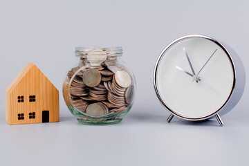 Time, coins and houses Saving money to build a house Home loans and cash, cash flow, assets and...