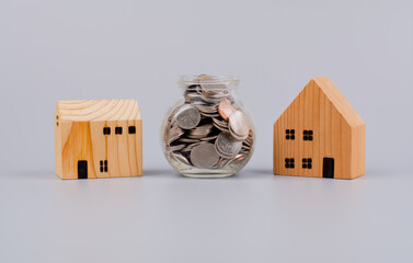 Coins and houses Saving money to build a house Home loans and cash, cash flow, assets and real...