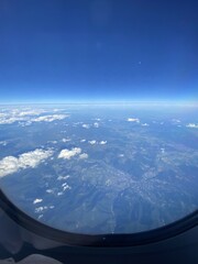 view from plane over europe blue sky