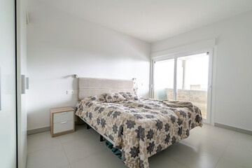 an image of a furnished bedroom in a mediterranean apartment