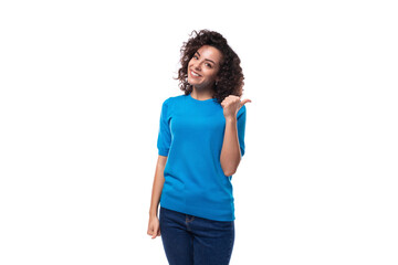 young woman with curly natural hair style dressed in a blue sweater