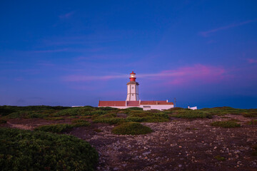 Fototapeta na wymiar Sunset landscape at cape Espichel and working lighthouse, Portugal