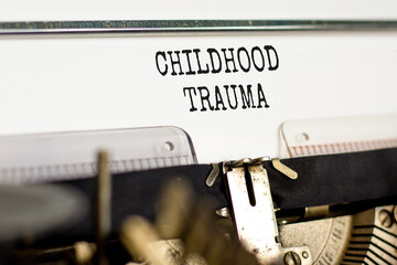 Childhood trauma symbol. Concept words Childhood trauma typed on beautiful old retro typewriter....