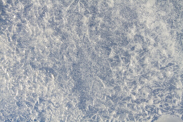 A blue pattern made up of frozen ice needles
