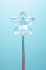 Fairy magic wand isolated on flat pastel background with copy space. Glass crystal in the shape of a star on a wand, creative concept vertical banner time of wonders, banner template.