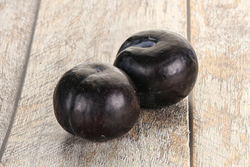 Two ripe sweet black plums
