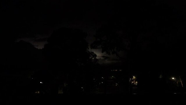 Display of lightning flashes across the night sky in real time filmed in South Sydney on 25 December 2023