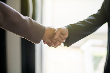 Close up hands of businessperson shaking hands during a meeting success, dealing, greeting and...