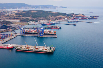 Fototapeta na wymiar Cargo ship loading on Cargo bulk port terminal, port international trade and logistic. Aerial view
