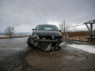 Seriously damaged car near roadside after accident in Romania.