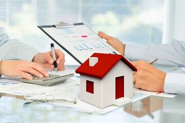 Real estate agent model house  on the desk