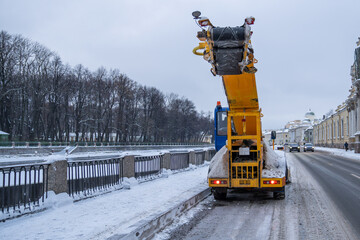 Professional industrial snow plow truck cleaning road after snowstorm, snowfall. Municipal service,...