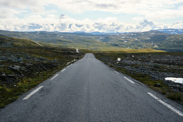 straight road to the mountains in norway