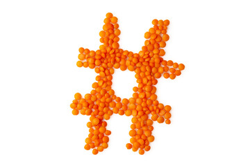 The symbol 'hash mark' formed from red lentil grains against a clean white backdrop. Perfect for a food blog and menu