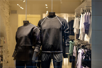 Mannequins in sport athletics suits in mall. Group of two mannequins in a store, close-up....