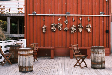 chairs and tables in a restaurant in the lofoten - obrazy, fototapety, plakaty