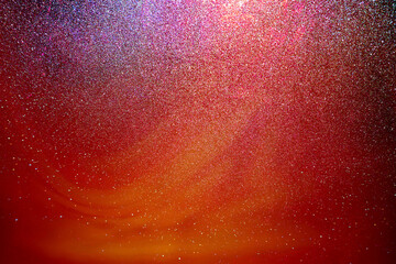 Black dark red orange golden brown shiny glitter abstract background with space. Twinkling glow...