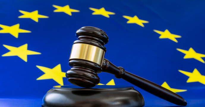 JUDGE GAVEL AND EUROPEAN FLAG. HUMAN RIGHTS IN THE COURT OF JUSTICE OF THE EUROPEAN UNION, CJEU.