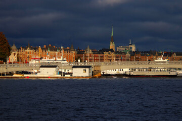 cityscape of Stockholm with dark clouds - obrazy, fototapety, plakaty