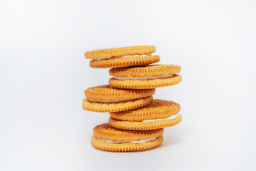 milk round cookies on a white background. shortbread cookies for tea drinking. a subject photo shoot of sweet cookies in a photo studio
