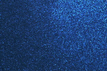 Abstract background of glowing blue bokeh spots or lights. High resolution full frame shiny blurred glitter background with copy space for New Year, celebration and parties.