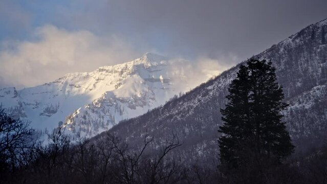 Timelapse of snowy landscape scene in the Utah wilderness viewing Cascade Mountain.