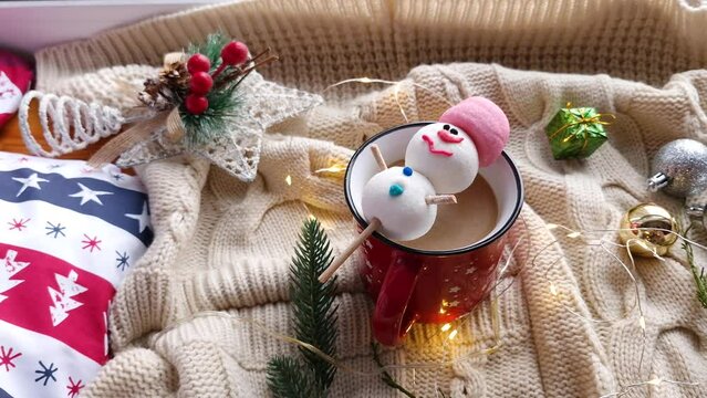 Red hot chocolate mug with melted snowman marshmallows