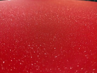 red roof of a family car with a frost in cold freezing winter time
