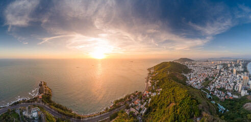 Panoramic coastal Vung Tau view from above, with waves, coastline, streets, coconut trees, Mount...