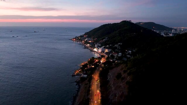 Aerial view of Vung Tau city, Vietnam, panoramic view of the peaceful and beautiful coastal city behind the statue of Christ the King standing on Mount Nho in Vung Tau city.