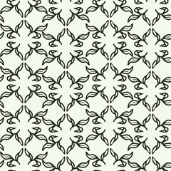 Fototapeta premium Abstract leaves symmetry seamless pattern for fabric, textile.,wallpaper, scrapbook. Vector background with doodle hand drawn floral elements
