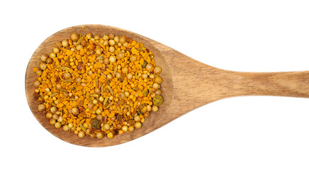 Curry spice mix in wooden spoon, turmeric, fenugreek, mustard, coriander, paprika, pepper and cumin isolated on white