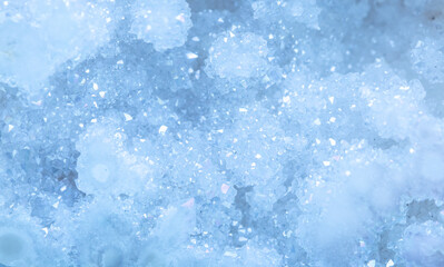 Obraz premium Blue Crystal Mineral Stone. Gems. Mineral crystals in the natural environment. Texture of precious and semiprecious stones. Seamless background with copy space colored shiny surface of precious stones