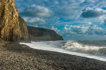 stormy Black Sea during a December storm near the beach and rocks of the Western Caucasus coast on...